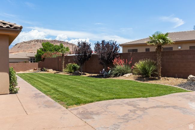 Fenced backyard featuring a patio area and a mountain view | Image 5
