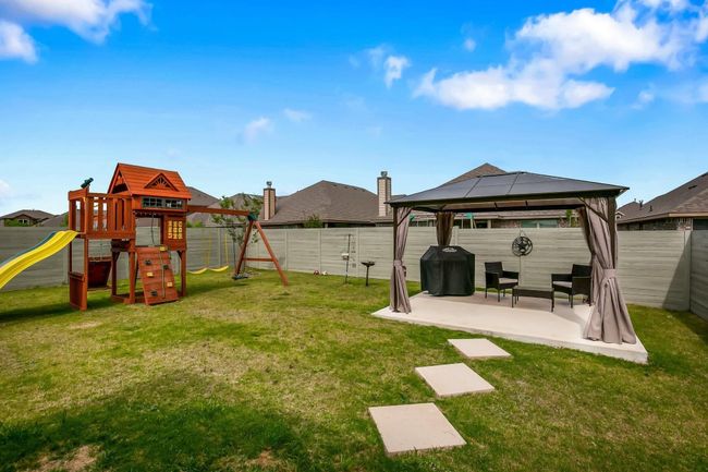 View of yard with a gazebo, a playground, and a patio area | Image 26
