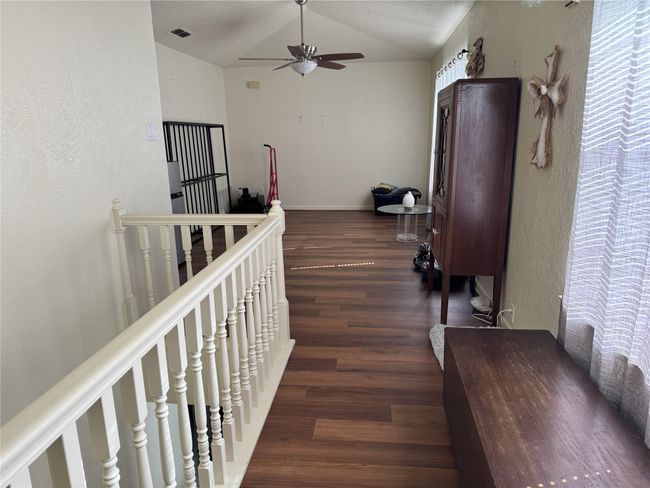 Hall with dark hardwood / wood-style floors and vaulted ceiling | Image 17