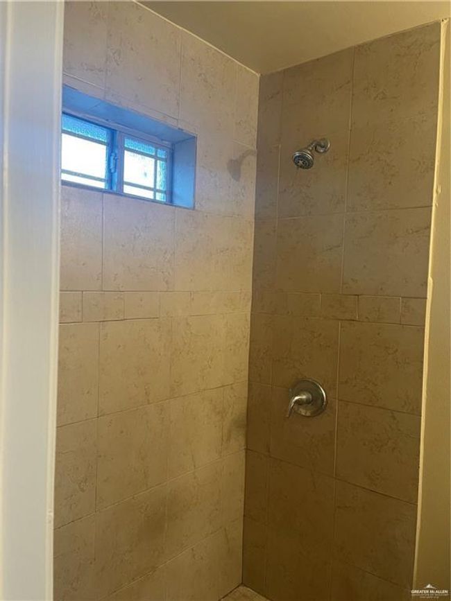 Full bathroom featuring a tile shower | Image 7