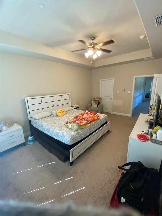 Bedroom with carpet floors and a raised ceiling | Image 20
