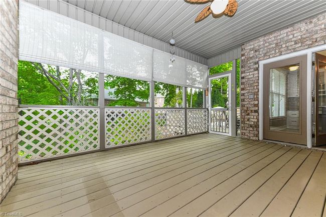 Main floor screen porch overlooking a lovely fenced in back yard | Image 27
