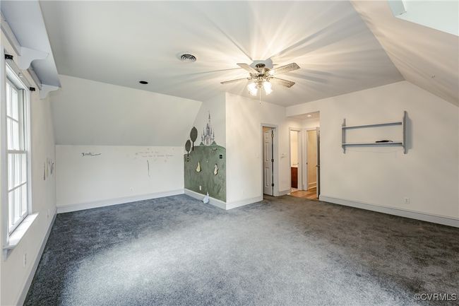 Bonus room with carpet, vaulted ceiling, a ceiling fan, healthy amount of natural light, and baseboards | Image 34