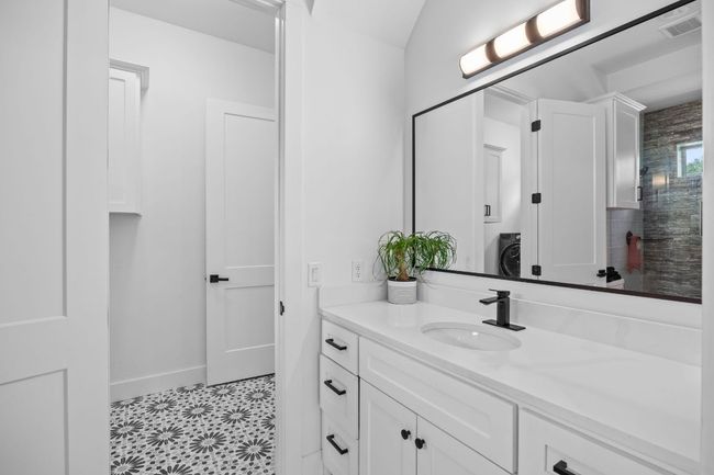 Bathroom with vanity and tile patterned floors | Image 19
