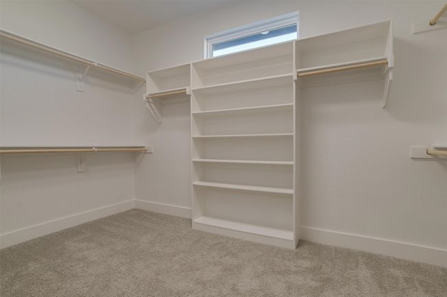 Spacious closet featuring carpet | Image 21