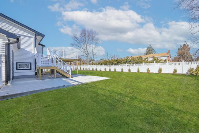 View of yard with a wooden deck | Image 5