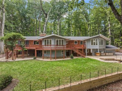 Back of property with a wooden deck and a lawn | Image 2