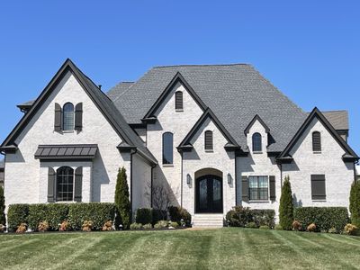 Step into a realm of seamless sophistication—where the elegance of open living meets the convenience of mostly one-level design, combining expansive spaces w/ a functional layout, offering a haven of tranquility & comfort for modern living. | Image 1