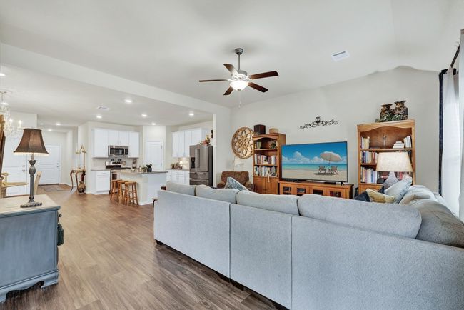 Living area featuring visible vents, recessed lighting, a ceiling fan, and wood finished floors | Image 14