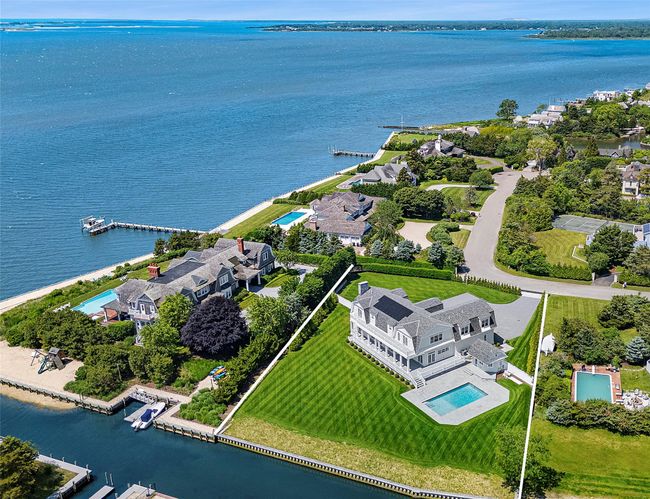 Aerial view of a pool and a large body of water | Image 5