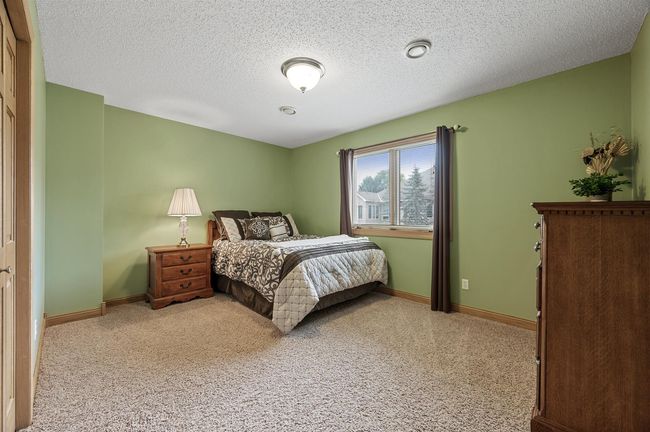 The fourth bedroom is also located in the lower. This 4 bedroom, 3 bathroom home offers over 3200 finished sq feet of living space! | Image 32