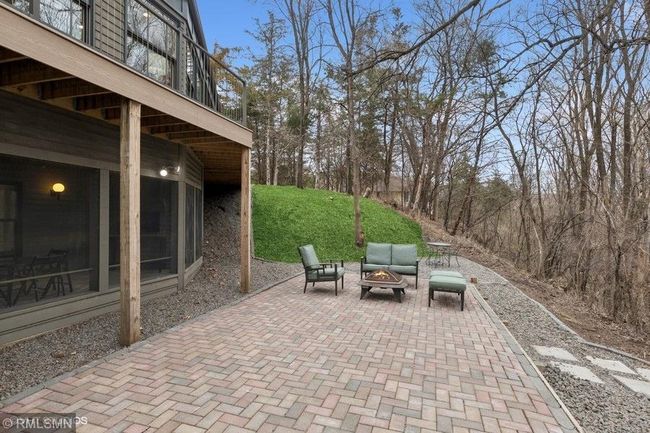 There are so many options to sit and enjoy the amazing views of this home! This paver patio is located on the walkout level on the back of the home! | Image 58