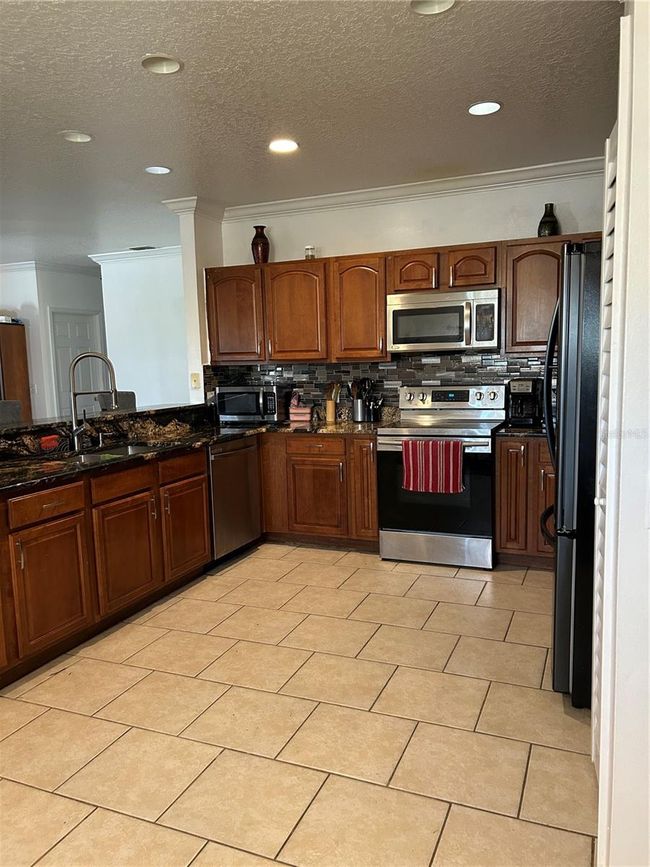 5406 Crepe Myrtle Cir, House other with 4 bedrooms, 3 bathrooms and null parking in KISSIMMEE FL | Image 21