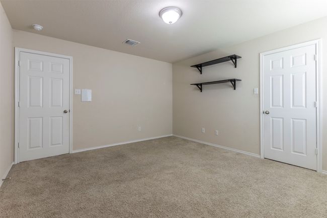 Carpeted empty room featuring baseboards and visible vents | Image 27