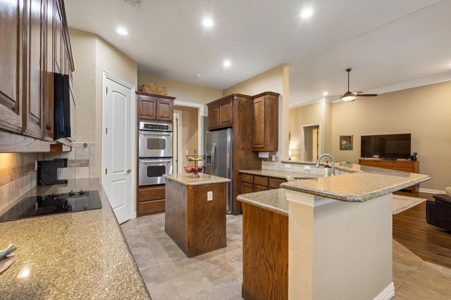 Double oven, electric cooktop and walk-in pantry. | Image 16