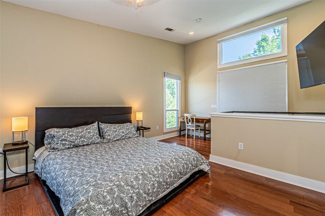 Bedroom featuring wood finished floors | Image 19