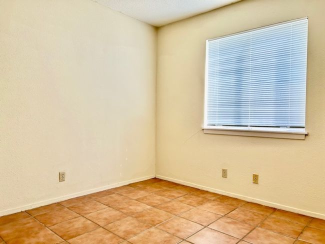 Spare room featuring baseboards and light tile patterned flooring | Image 6