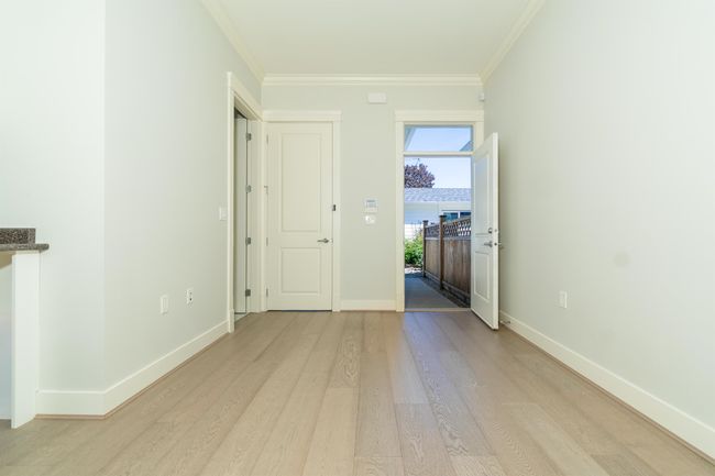 Unfurnished room with light wood-type flooring, ornamental molding, and baseboards | Image 12