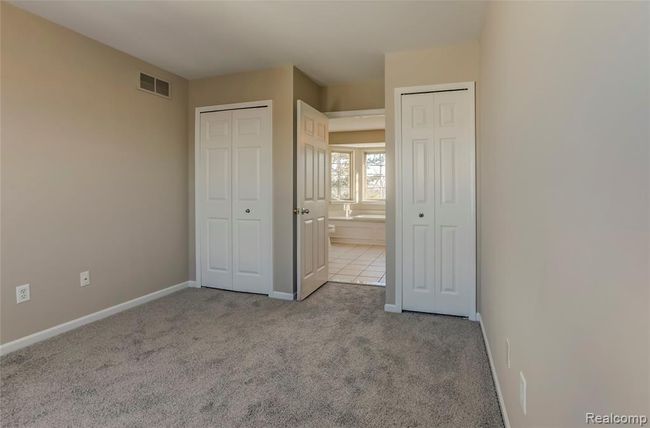 Master bedroom on upper level, with 2 closets and adjacent to the shared jack and jill full bath. | Image 12