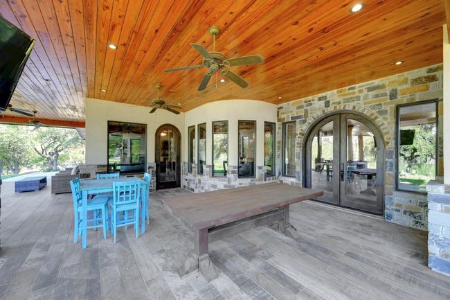 View of patio / terrace with outdoor dining area, french doors, and ceiling fan | Image 35