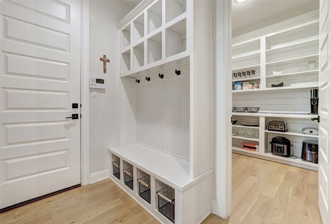 Mudroom with light wood-type flooring | Image 30