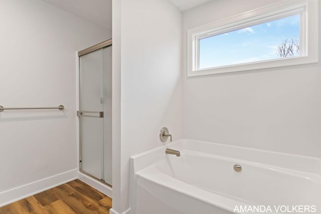 Primary bath tub and shower | Image 33