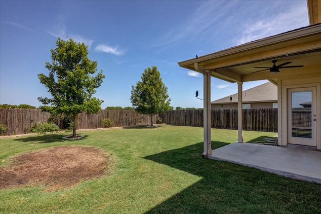 Room for a garden or a pool. Lovely covered patio. | Image 35