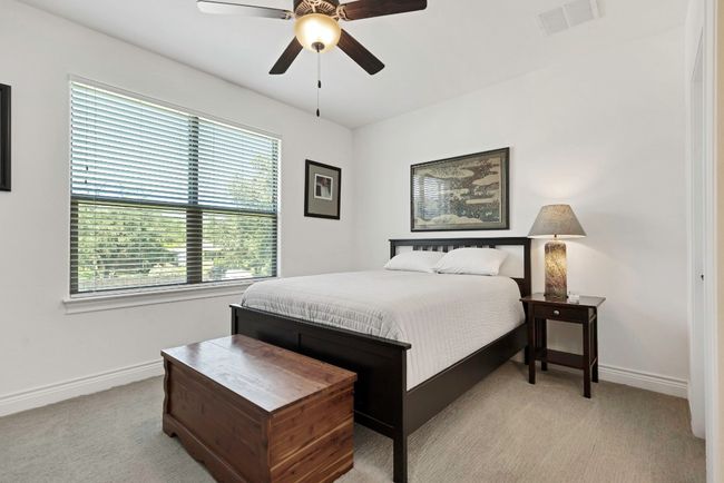 Carpeted bedroom with baseboards and a ceiling fan | Image 19