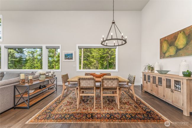 Seamless flow between the kitchen, dining, and living areas create an inviting atmosphere for hosting in style and comfort | Image 12