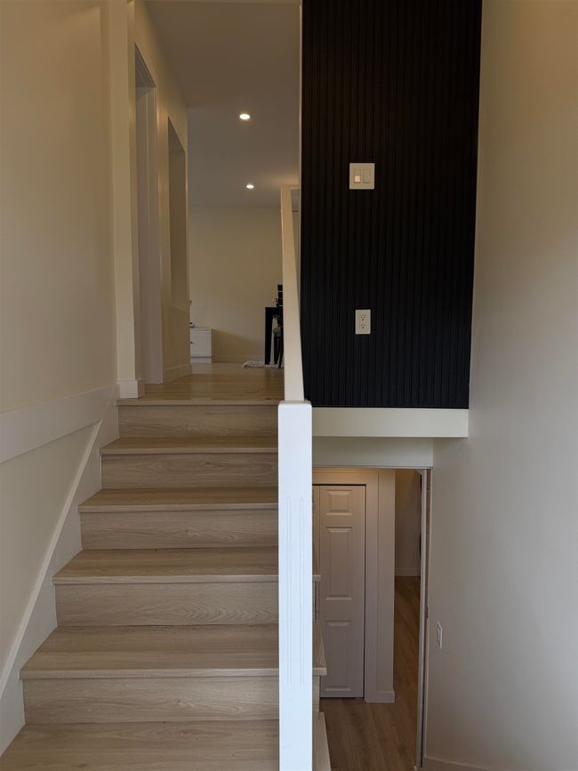 Stairway featuring wood finished floors and recessed lighting | Image 17