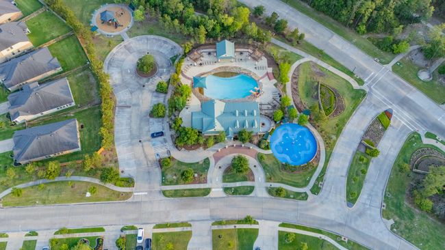 Experience resort-style living at the stunning community clubhouse—complete with a sparkling pool, spacious sun deck, and serene pond views surrounded by lush greenery. The perfect place to relax, gather, and enjoy life at The Falls at Imperial Oaks. | Image 43