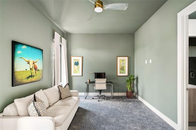 This versatile third-floor space functions beautifully as a bedroom or home office and includes an en suite bath for added privacy and convenience. Ideal for guests, remote work, or a quiet retreat. | Image 31