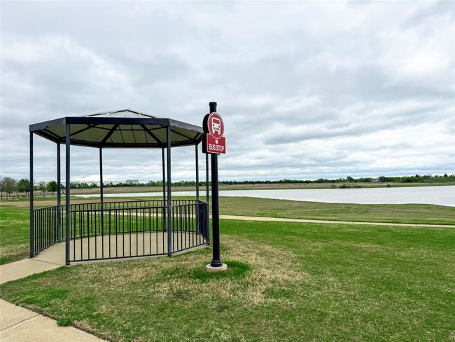 View of home's community featuring a water view and a lawn | Image 28