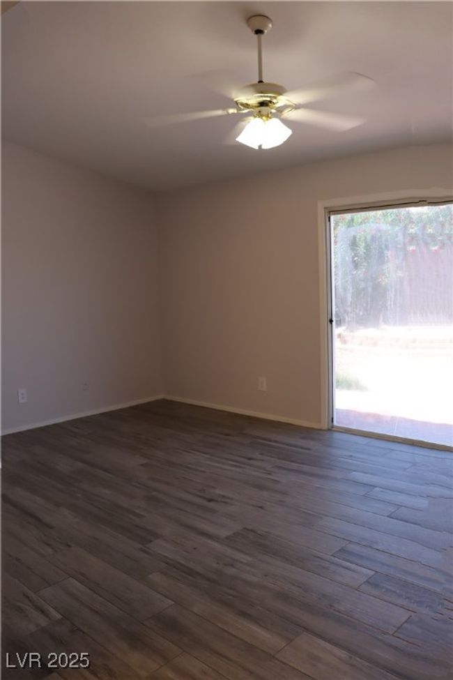 Walk in closet featuring dark wood-type flooring | Image 10
