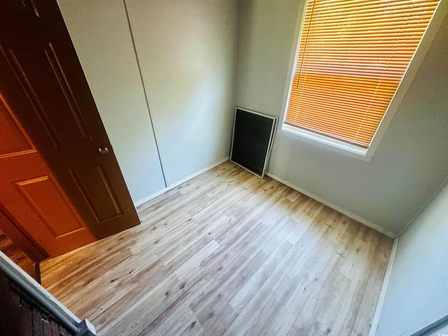 Unfurnished bedroom featuring light wood-type flooring and baseboards | Image 13