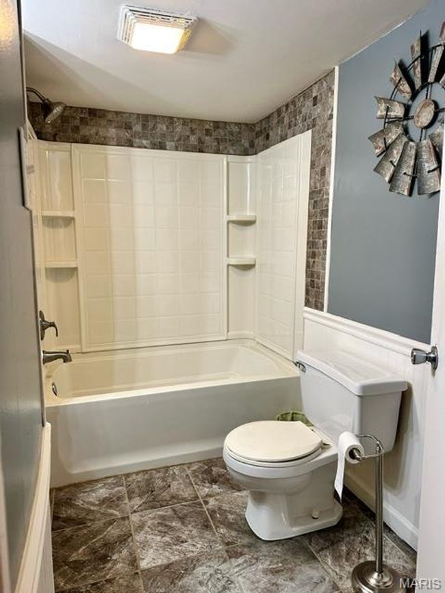 Bathroom with shower combination and toilet | Image 25