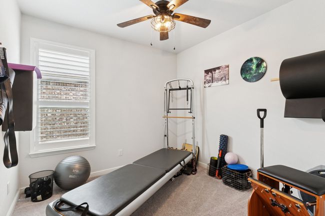 Exercise area with carpet and ceiling fan | Image 21