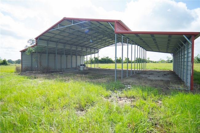 View of car parking featuring a carport and driveway | Image 4