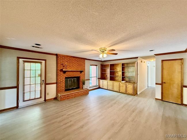 Back patio is accessible from the den. | Image 7