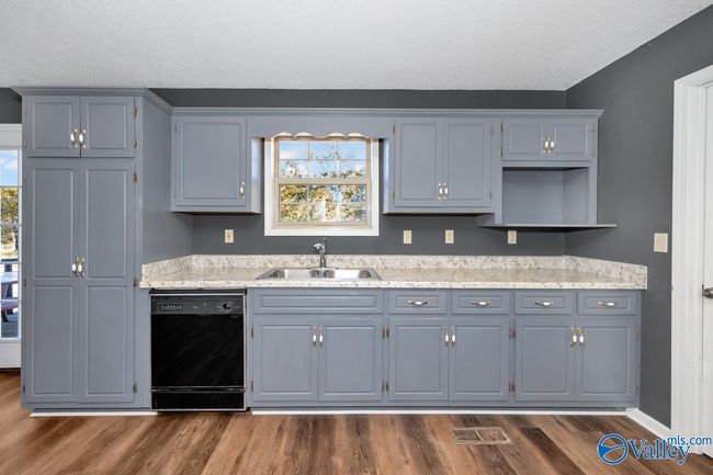 New LVP flooring and paint, wood cabinetry, pantry | Image 24