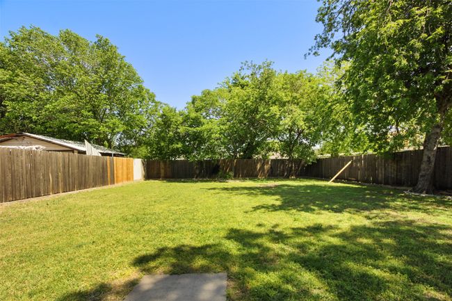 View of yard featuring a fenced backyard | Image 13