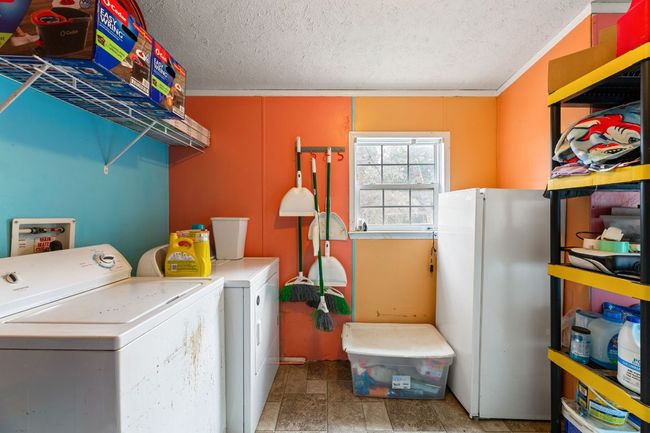 Laundry room with washer and clothes dryer | Image 17
