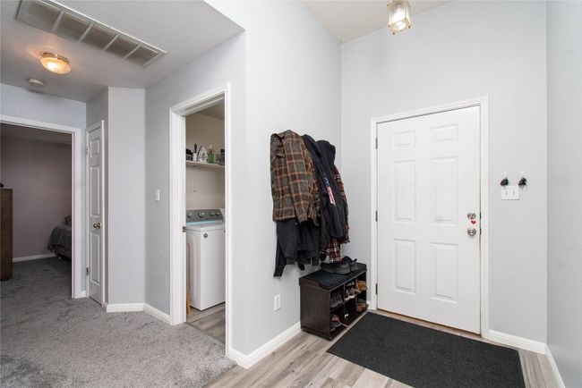 Entryway featuring washer / clothes dryer, baseboards, and visible vents | Image 9