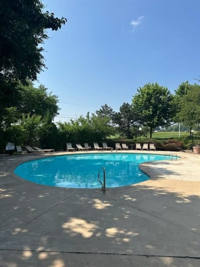 Community pool featuring a patio | Image 19