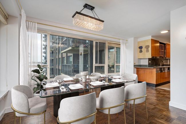 Virtually Stage Dining area with baseboards, a chandelier, and recessed lighting | Image 7