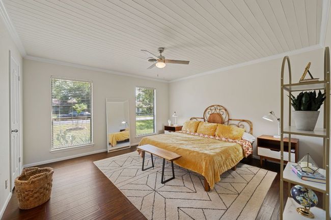 Primary bedroom is situated on one side of the home and the two secondary bedrooms are on the other side of the home, known as a "mother-in-law plan". | Image 16