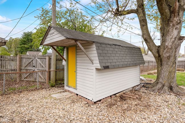view of shed featuring a gate and a fenced backyard | Image 9