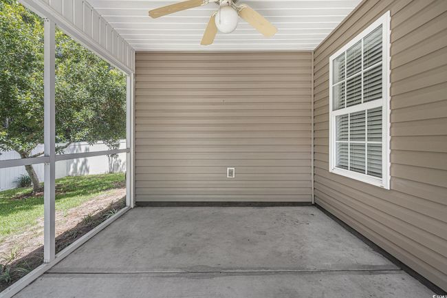 Unfurnished sunroom with a ceiling fan | Image 31