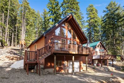 The quintessential cabin, nestled in the trees. | Image 1