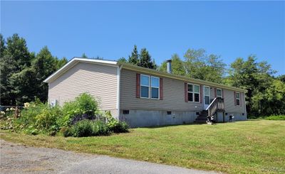 View of front of home with a front lawn | Image 1